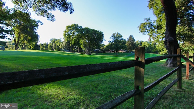 surrounding community with a lawn