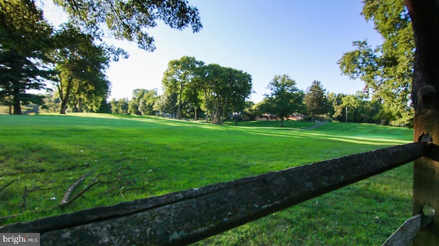 view of property's community featuring a yard