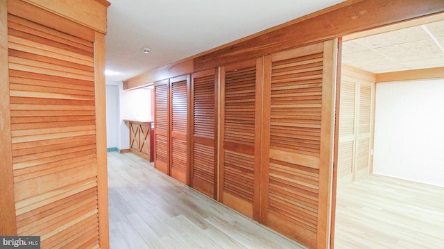 hallway with light wood-type flooring