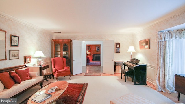 living room with light wood-type flooring and ornamental molding