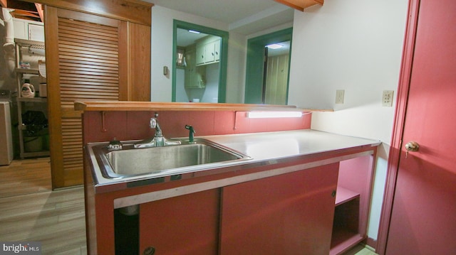 bathroom featuring hardwood / wood-style floors and sink