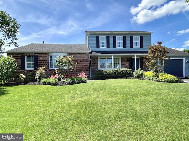 traditional-style home with brick siding, an attached garage, driveway, and a front lawn