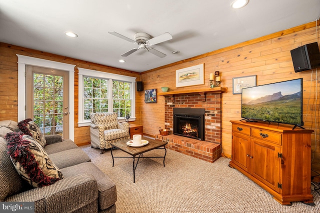 living area featuring a fireplace, recessed lighting, a ceiling fan, and light carpet