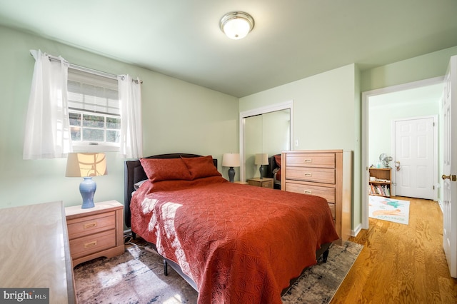 bedroom featuring a closet and wood finished floors