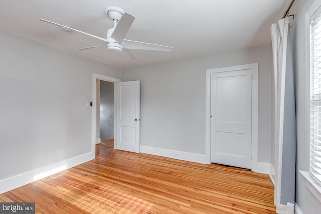 unfurnished bedroom featuring ceiling fan and hardwood / wood-style floors