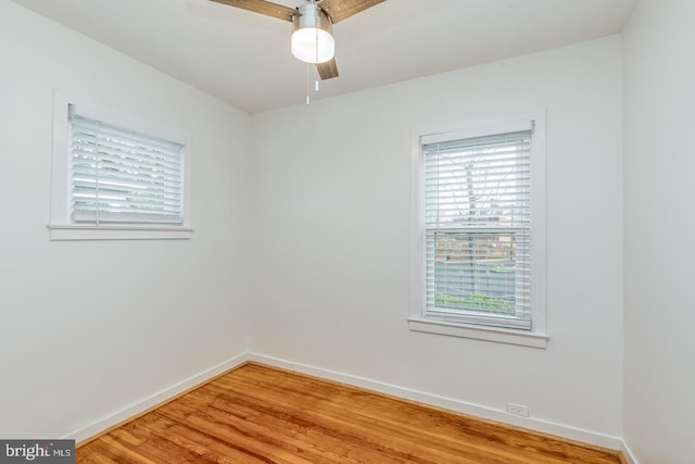 unfurnished room featuring ceiling fan and hardwood / wood-style flooring