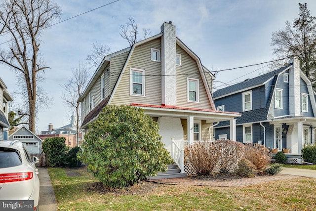 view of front property featuring covered porch