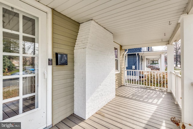 wooden terrace with a porch