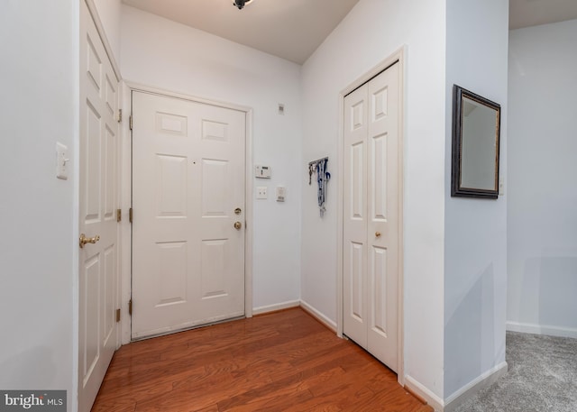 doorway with hardwood / wood-style floors