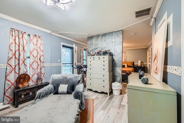 bedroom featuring light hardwood / wood-style floors and ornamental molding