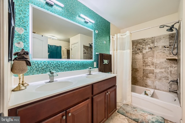 bathroom with tasteful backsplash, tile patterned flooring, vanity, and shower / bath combo