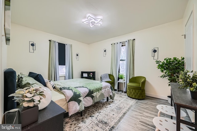 bedroom with light wood-type flooring