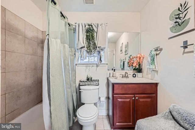 full bathroom featuring tile patterned flooring, shower / tub combo with curtain, vanity, and toilet