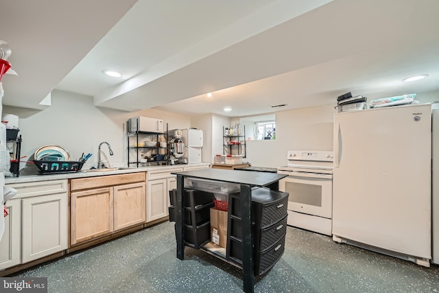 kitchen featuring kitchen peninsula, sink, light brown cabinetry, and white appliances