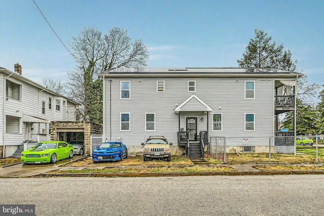 view of front of house with solar panels