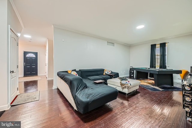 living room featuring crown molding and dark hardwood / wood-style flooring