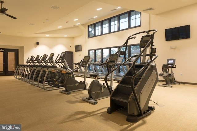 gym with light colored carpet and french doors