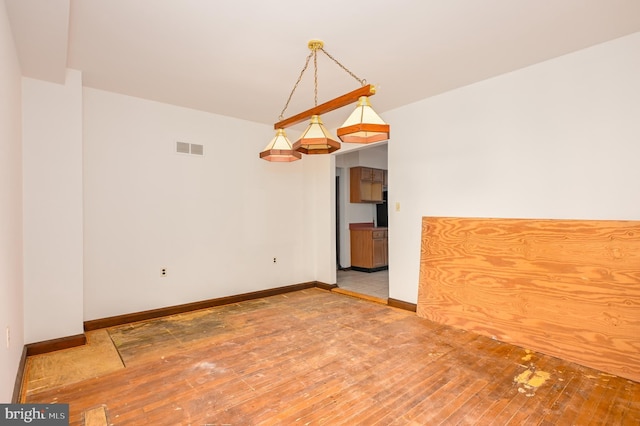 spare room featuring hardwood / wood-style flooring