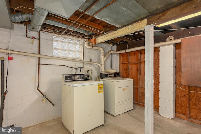 basement with washing machine and clothes dryer