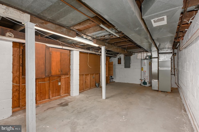 basement with electric panel, gas water heater, and heating unit