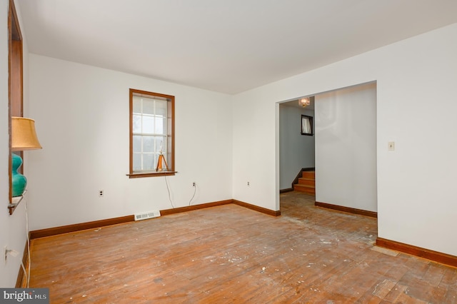 spare room featuring light wood-type flooring