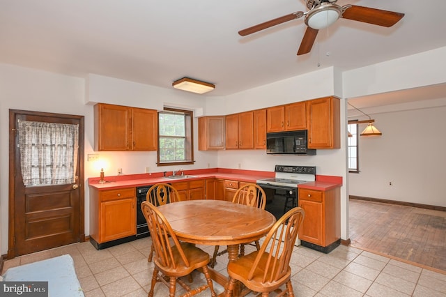 kitchen with ceiling fan, sink, black appliances, and light hardwood / wood-style floors