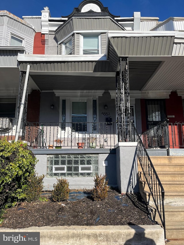 view of property with covered porch