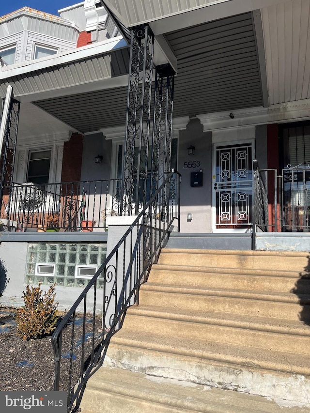 entrance to property with a porch