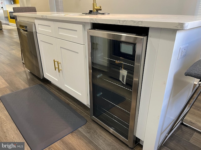 kitchen featuring dishwasher, dark wood-type flooring, white cabinets, sink, and wine cooler