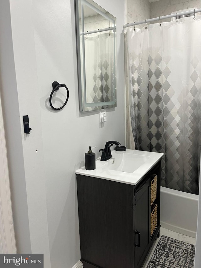 bathroom with shower / tub combo with curtain and vanity