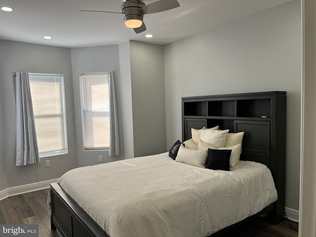 bedroom featuring dark hardwood / wood-style floors and ceiling fan