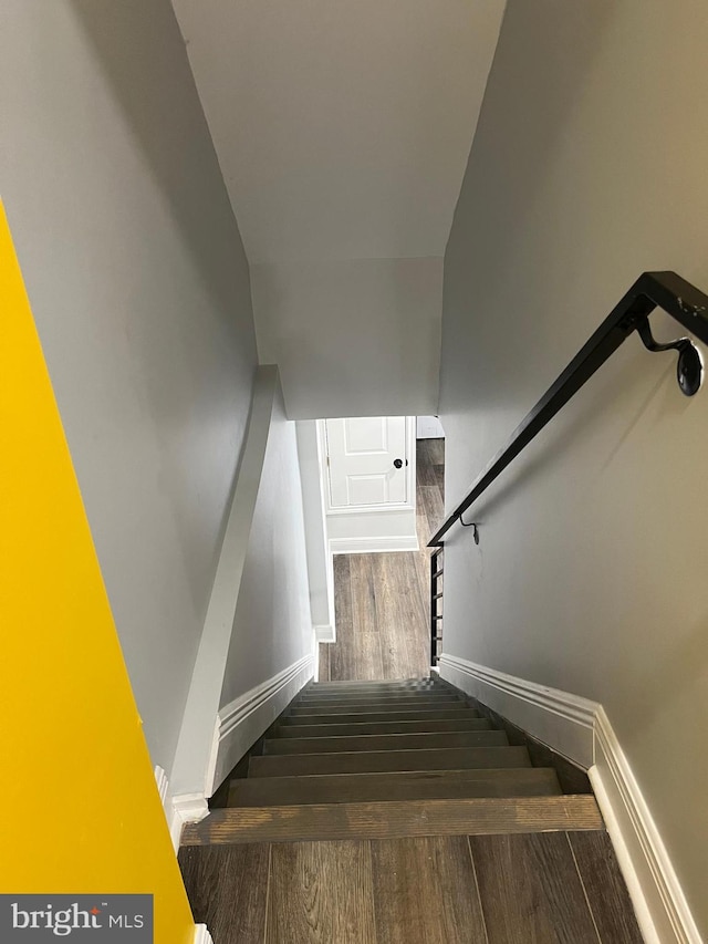 stairway featuring hardwood / wood-style floors