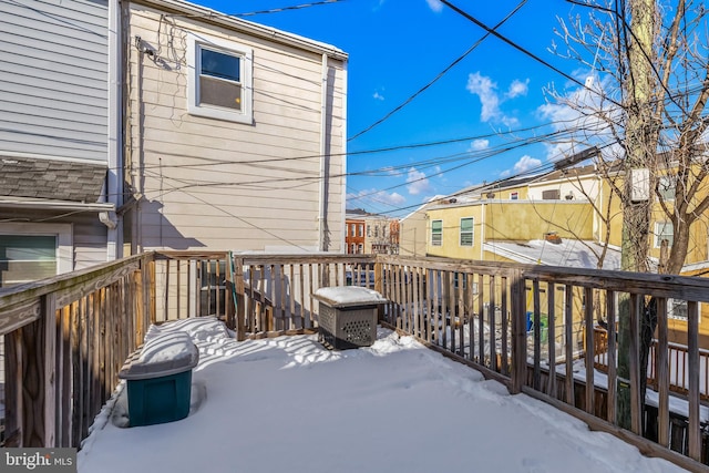 view of snow covered deck