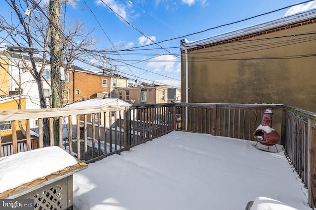 view of snow covered deck