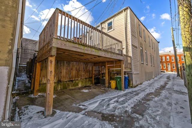 view of property exterior with a deck