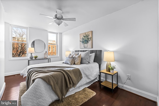 bedroom featuring ceiling fan and dark hardwood / wood-style floors