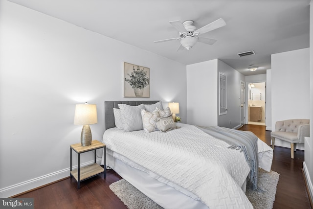 bedroom with connected bathroom, ceiling fan, a closet, and dark wood-type flooring