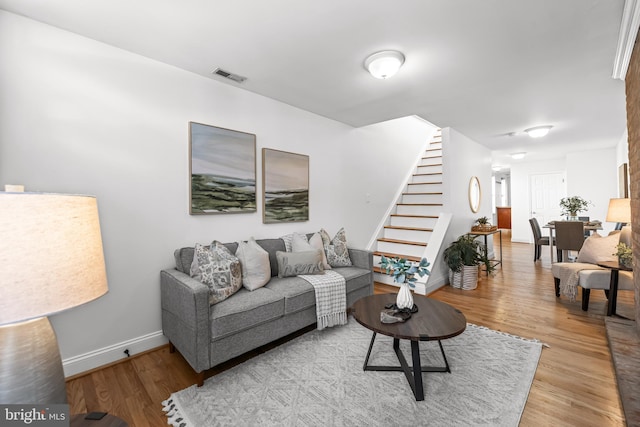 living room with light hardwood / wood-style flooring