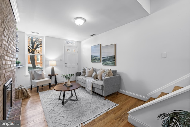 living room featuring a fireplace and hardwood / wood-style flooring