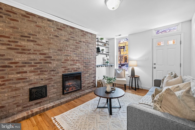 living room with hardwood / wood-style floors and a fireplace