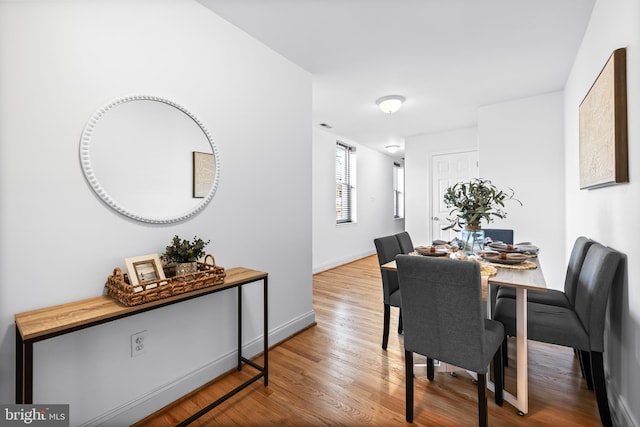 dining area featuring hardwood / wood-style flooring