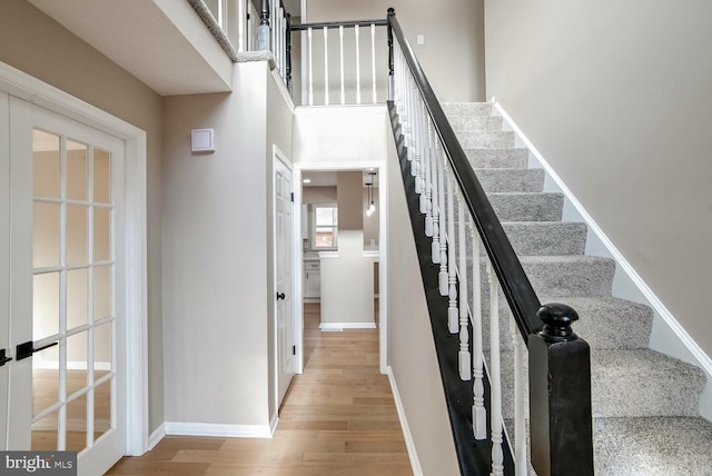 stairway with wood-type flooring