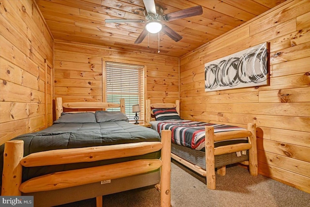 carpeted bedroom featuring wood ceiling, ceiling fan, and wood walls