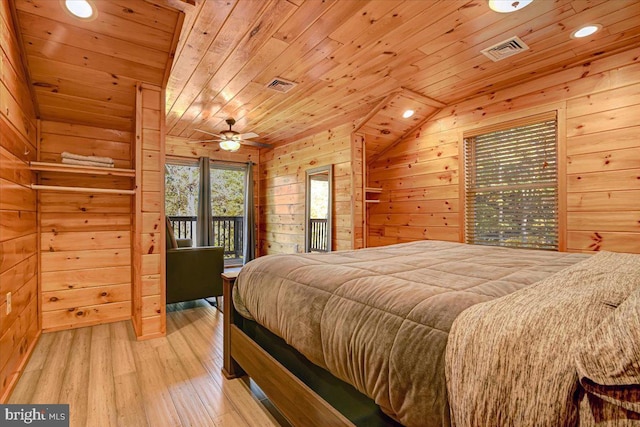 bedroom with wooden ceiling, light hardwood / wood-style flooring, wood walls, vaulted ceiling, and access to outside