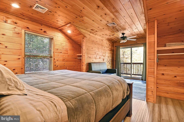 bedroom with access to outside, multiple windows, light hardwood / wood-style flooring, and wooden ceiling