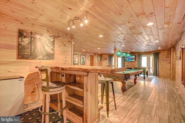 recreation room featuring wood walls, wood ceiling, billiards, and light hardwood / wood-style flooring