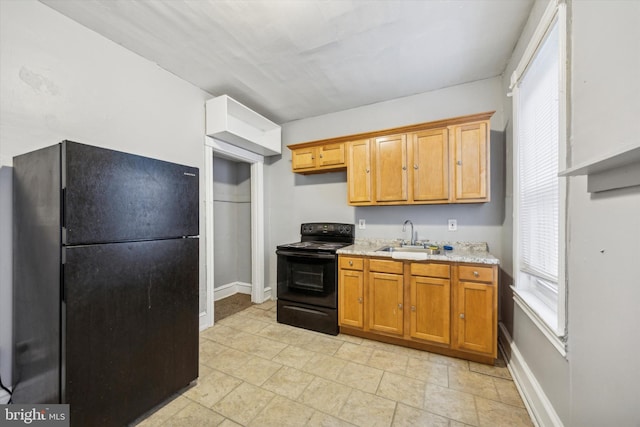 kitchen with sink and black appliances