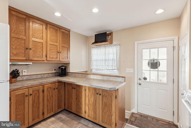 kitchen featuring white fridge