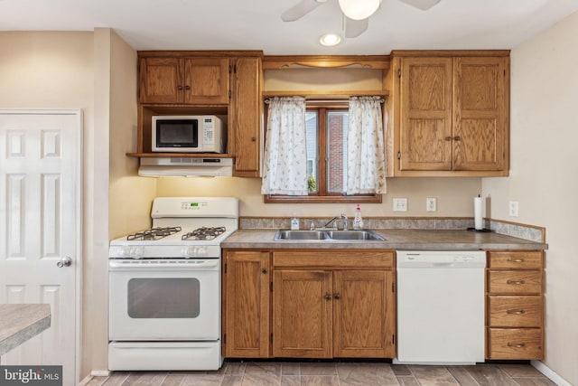 kitchen featuring ceiling fan, white appliances, and sink