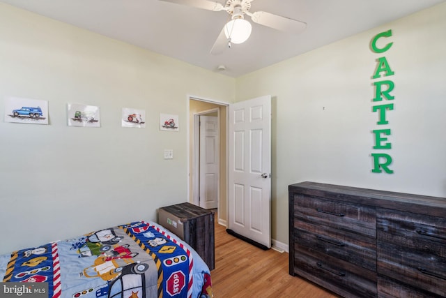 bedroom with ceiling fan and light wood-type flooring